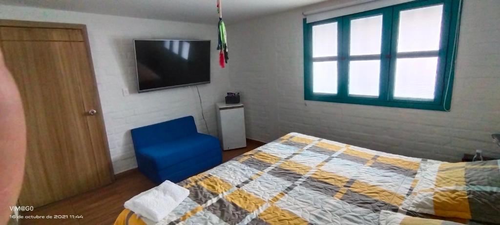 Postel nebo postele na pokoji v ubytování Hotel Casa Tita en Versalles Valle del Cauca