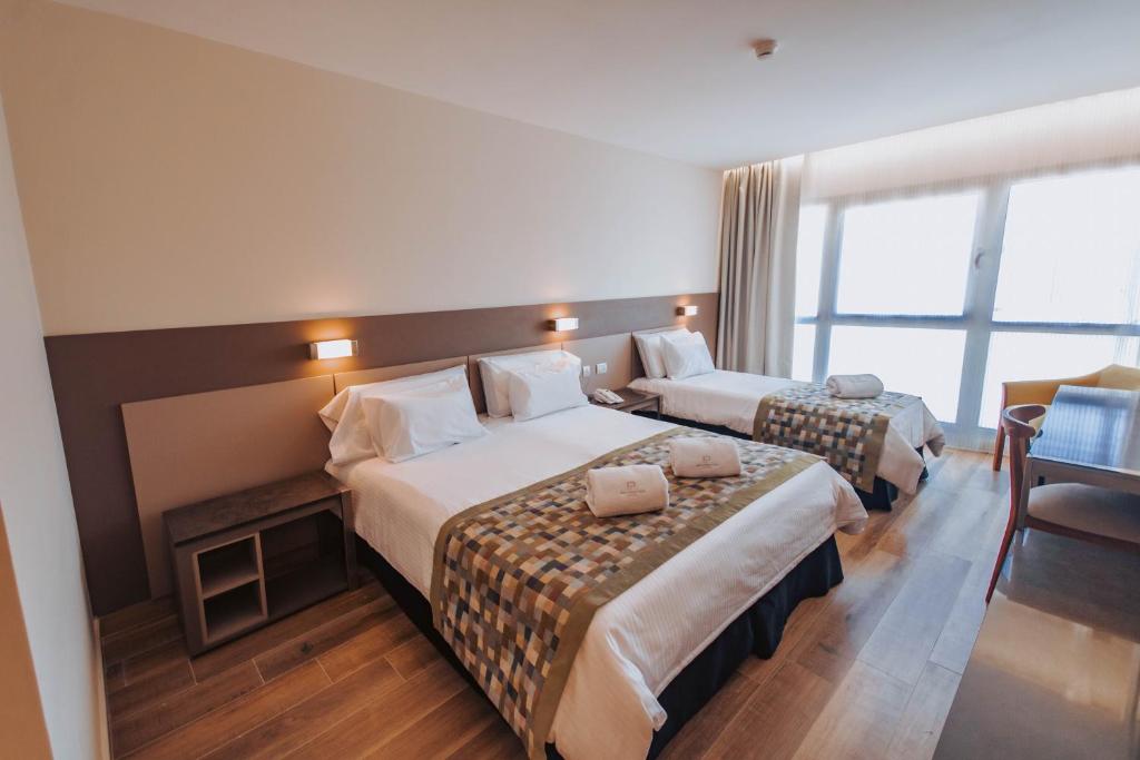 Postel nebo postele na pokoji v ubytování SEC Hotel