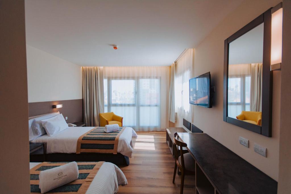 Postel nebo postele na pokoji v ubytování SEC Hotel