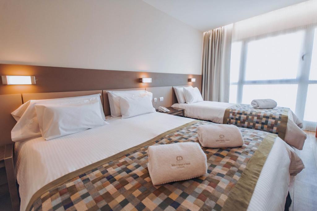 Postel nebo postele na pokoji v ubytování SEC Hotel