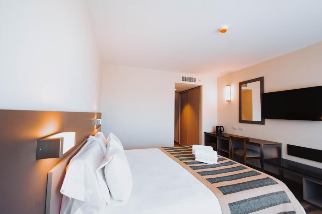 Postel nebo postele na pokoji v ubytování SEC Hotel