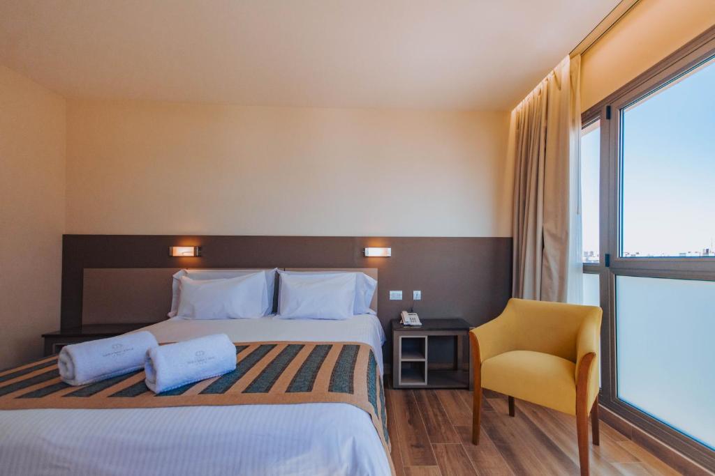 Postel nebo postele na pokoji v ubytování SEC Hotel