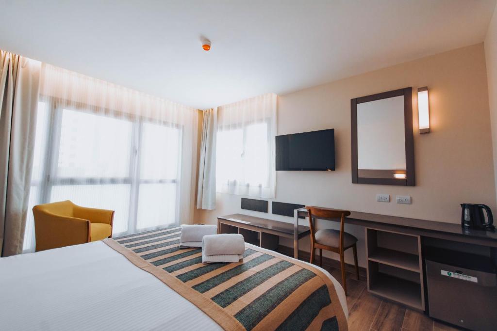 TV a/nebo společenská místnost v ubytování SEC Hotel