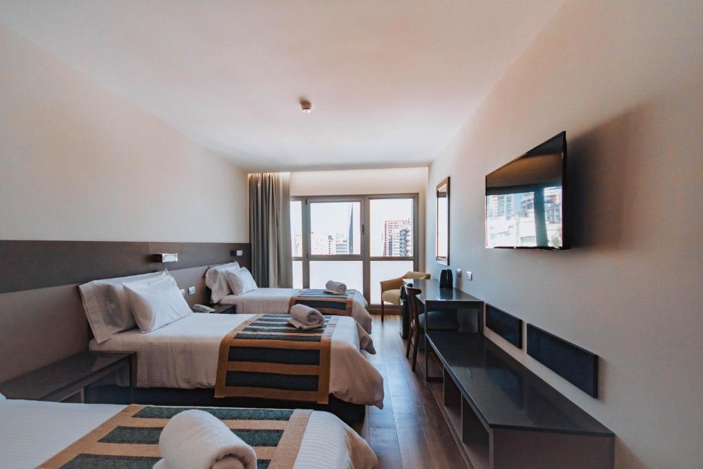 TV a/nebo společenská místnost v ubytování SEC Hotel