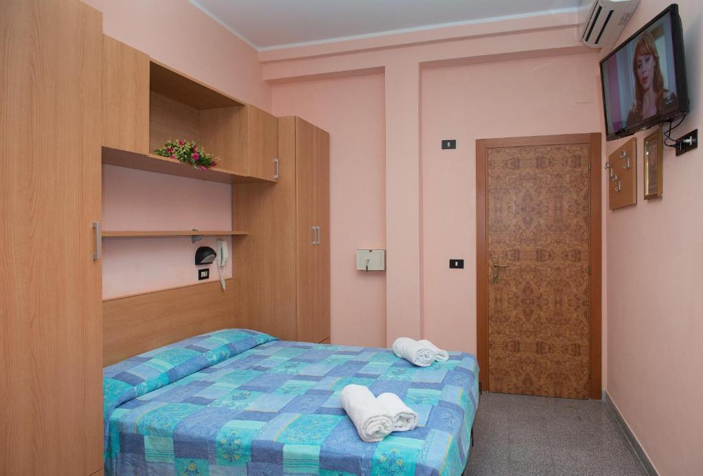 Postel nebo postele na pokoji v ubytování Hotel Colibri B&B
