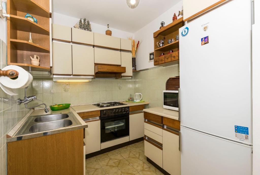 Kuchyňa alebo kuchynka v ubytovaní Apartments Neno