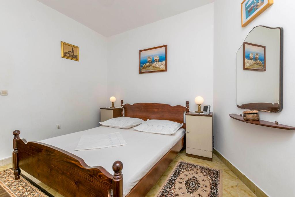 Posteľ alebo postele v izbe v ubytovaní Apartments Neno