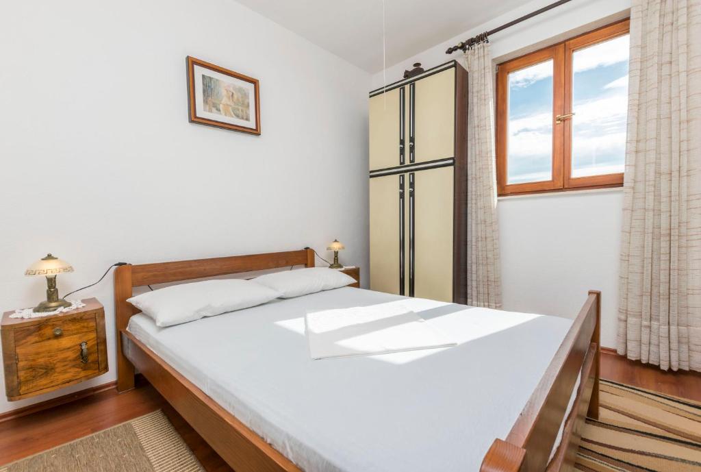 Posteľ alebo postele v izbe v ubytovaní Apartments Neno
