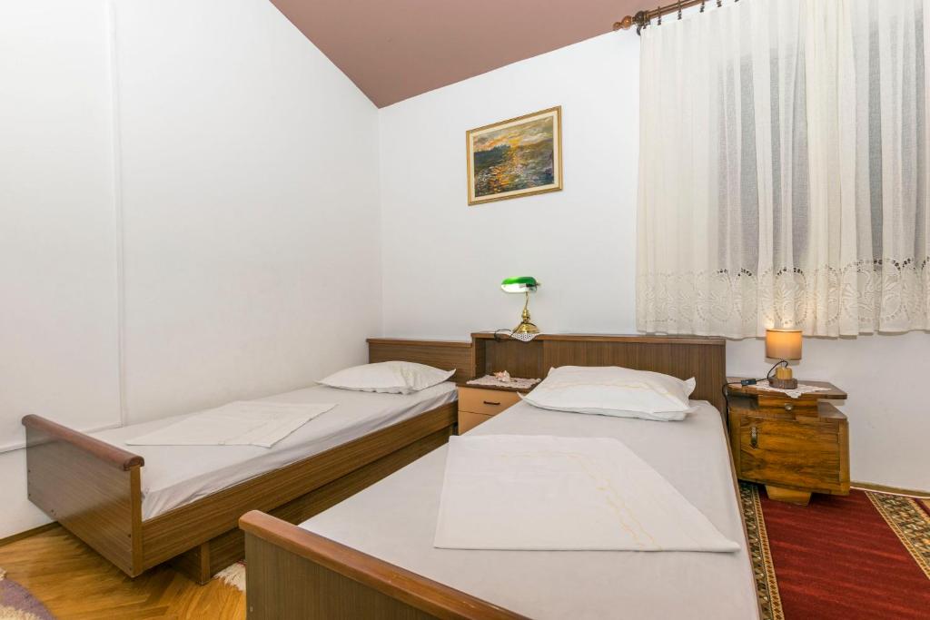 Posteľ alebo postele v izbe v ubytovaní Apartments Neno