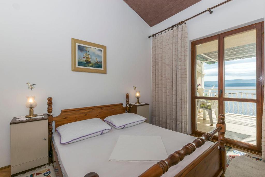 Posteľ alebo postele v izbe v ubytovaní Apartments Neno