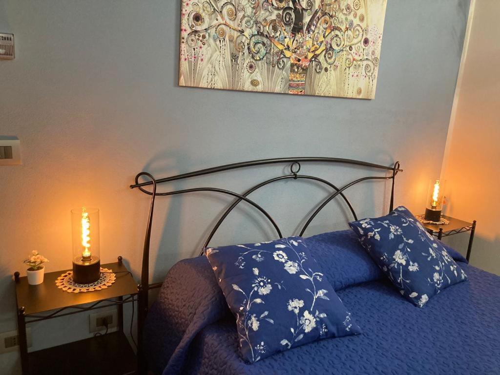 Postel nebo postele na pokoji v ubytování IL CORTILETTO 2
