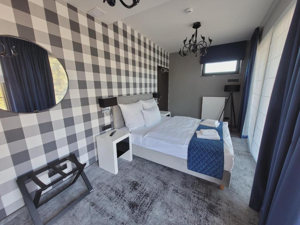 Postel nebo postele na pokoji v ubytování Hotel Sanova