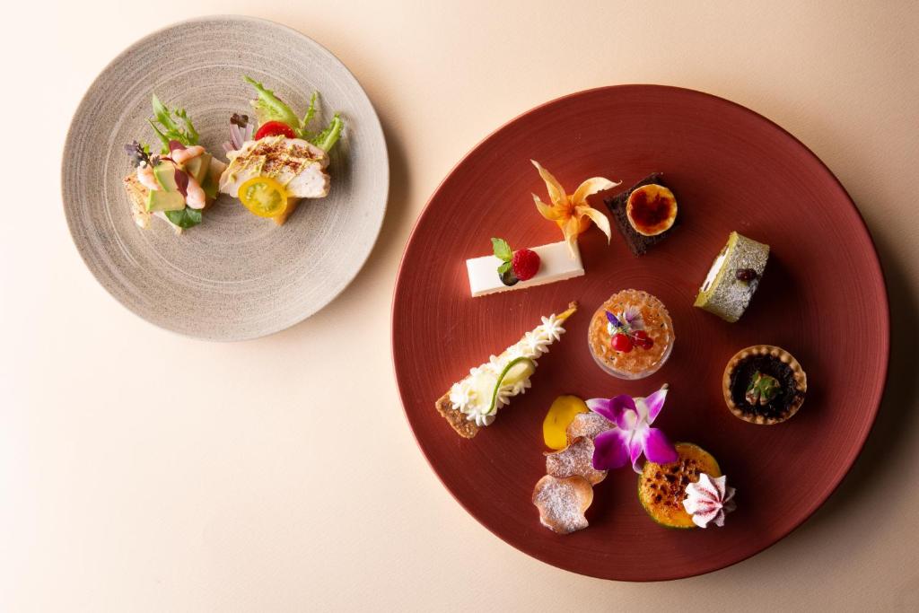 two plates of food sitting on a table at Nikko Style Nagoya in Nagoya