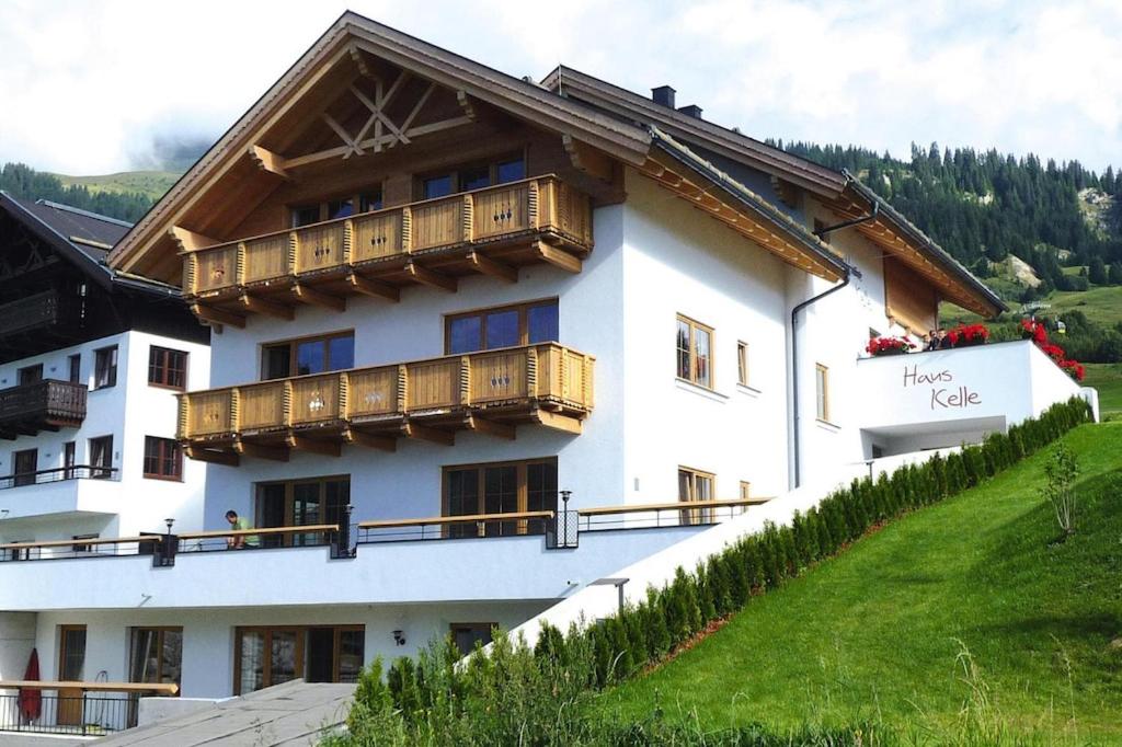 a large white building with wooden balconies on it at holiday home, Fiss in Fiss