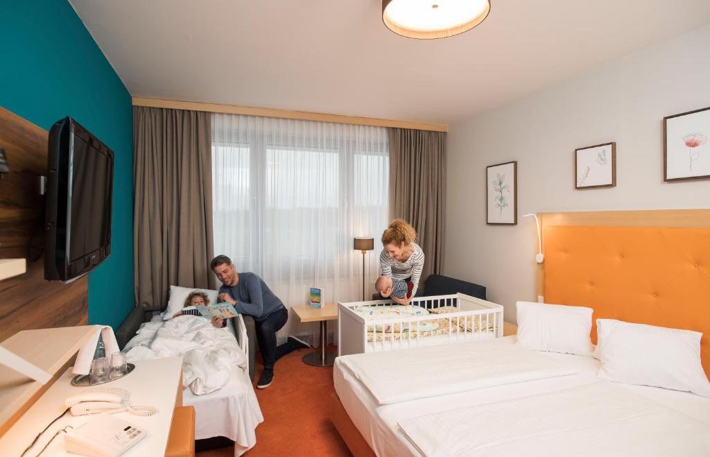 Postel nebo postele na pokoji v ubytování Hotel Sonnenpark & Therme included - auch am An- & Abreisetag!