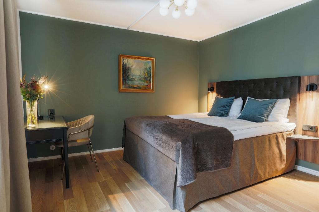 Postel nebo postele na pokoji v ubytování Home Hotel Cardinal