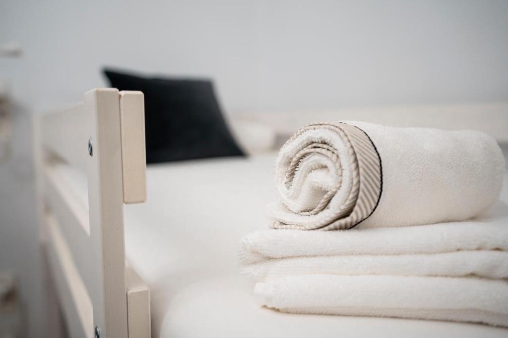 Postel nebo postele na pokoji v ubytování HiHome Hostel Uría