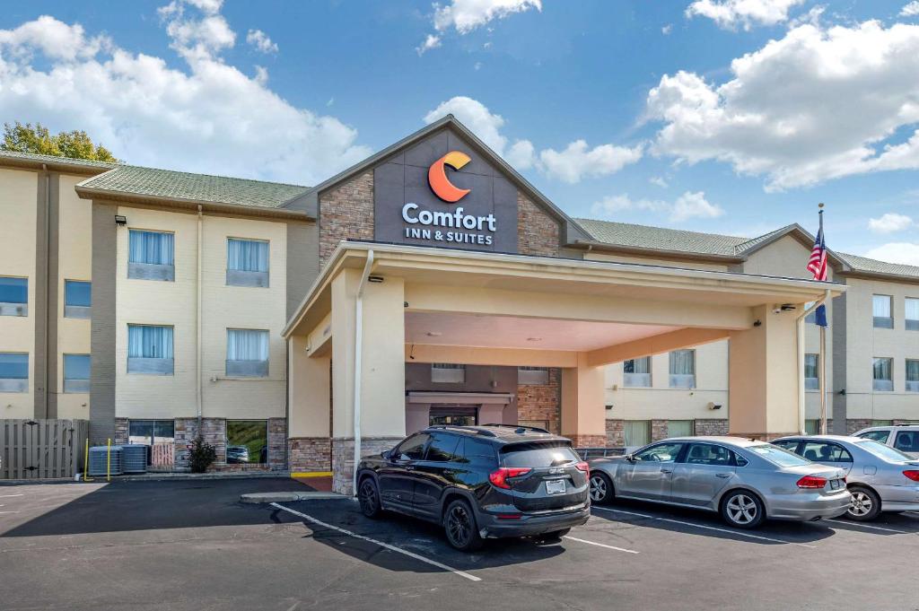 a car parked in a parking lot in front of a hotel at Comfort Inn & Suites in Cincinnati