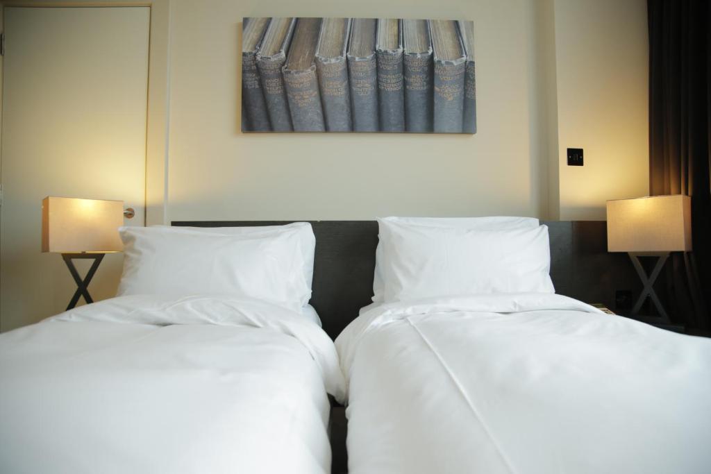Postel nebo postele na pokoji v ubytování Hotel Xanadu