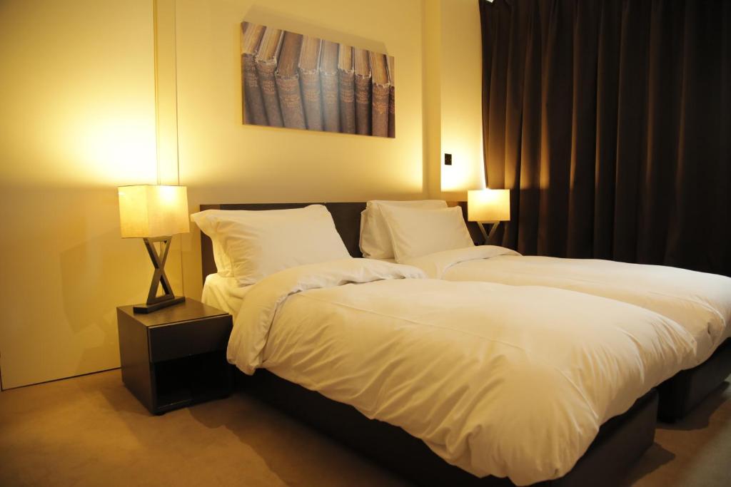 Postel nebo postele na pokoji v ubytování Hotel Xanadu