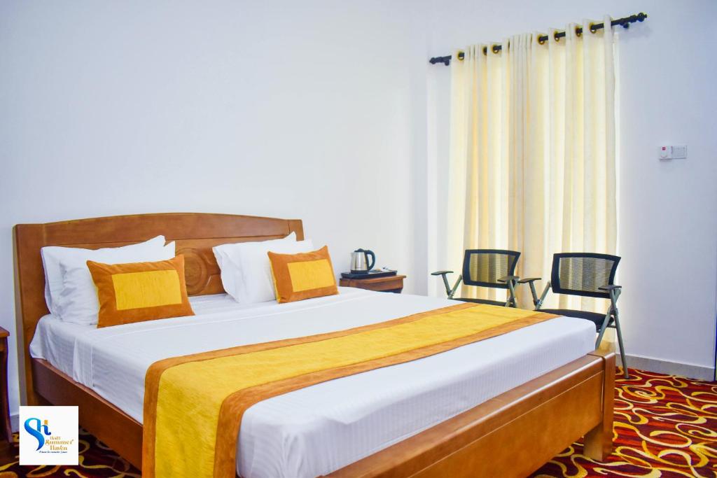 Postel nebo postele na pokoji v ubytování Hotel Summer Haven