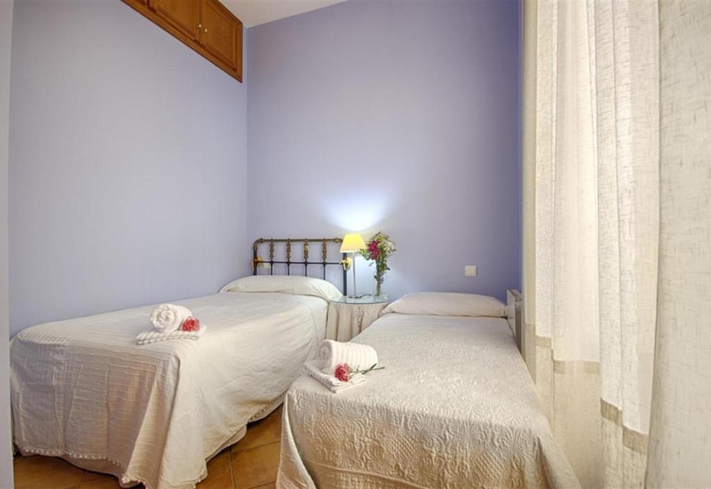 Posteľ alebo postele v izbe v ubytovaní Picasso Flat
