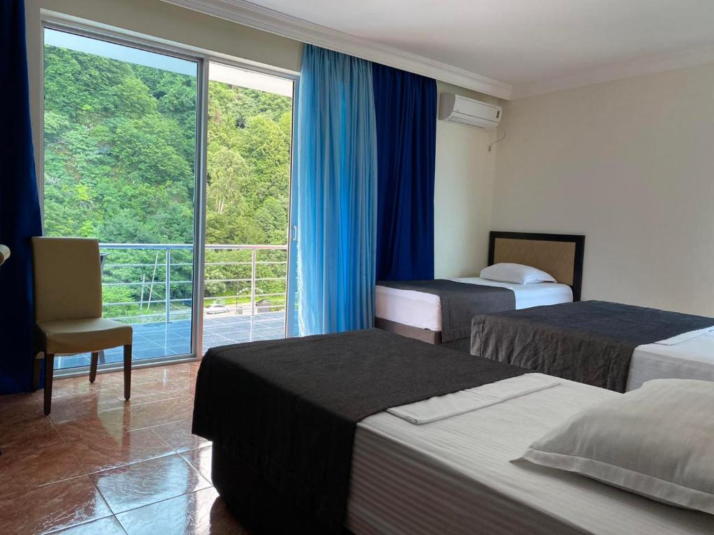 Postel nebo postele na pokoji v ubytování Hotel Neptun Kvariati
