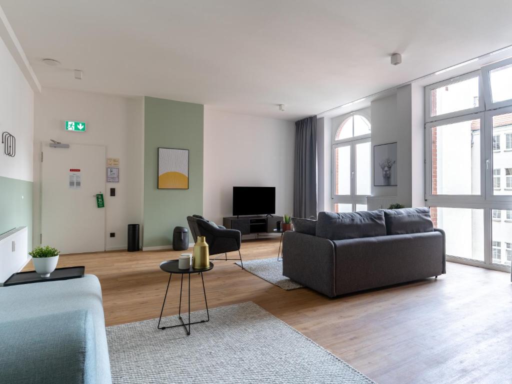 TV a/nebo společenská místnost v ubytování limehome Erfurt Schmidtstedter Straße