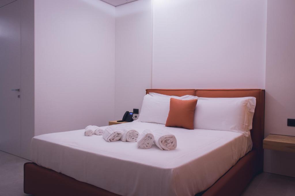 Postel nebo postele na pokoji v ubytování Sunset Hotel