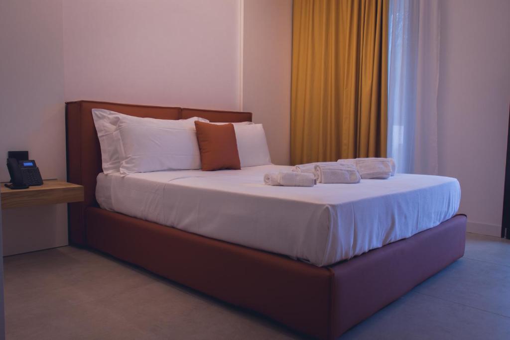 Postel nebo postele na pokoji v ubytování Sunset Hotel