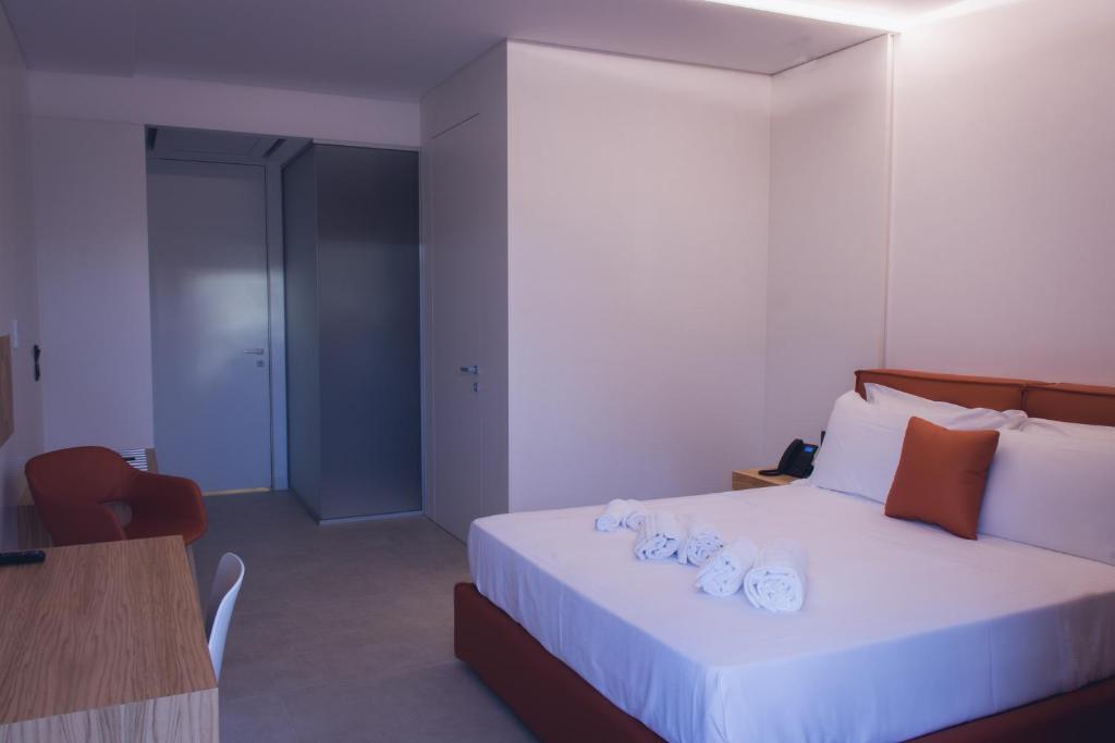Postel nebo postele na pokoji v ubytování Sunset Hotel