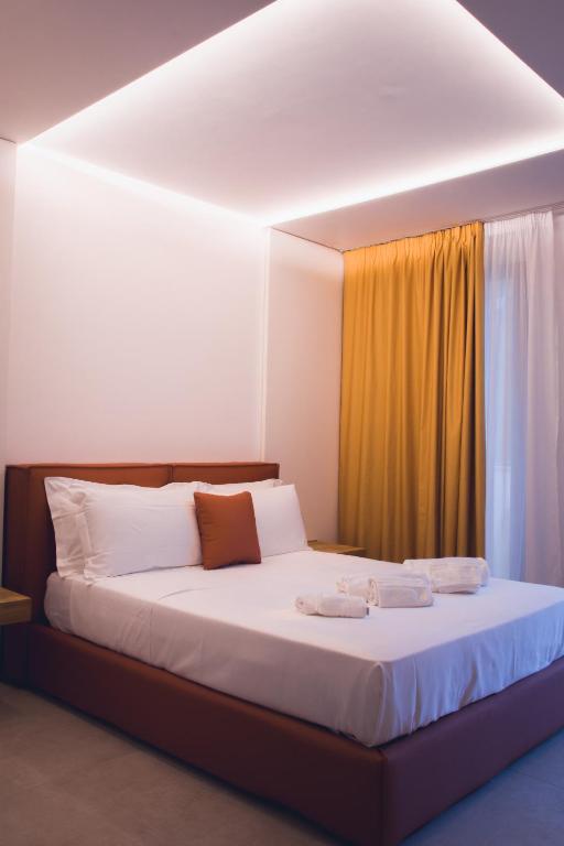 Postel nebo postele na pokoji v ubytování Sunset Hotel