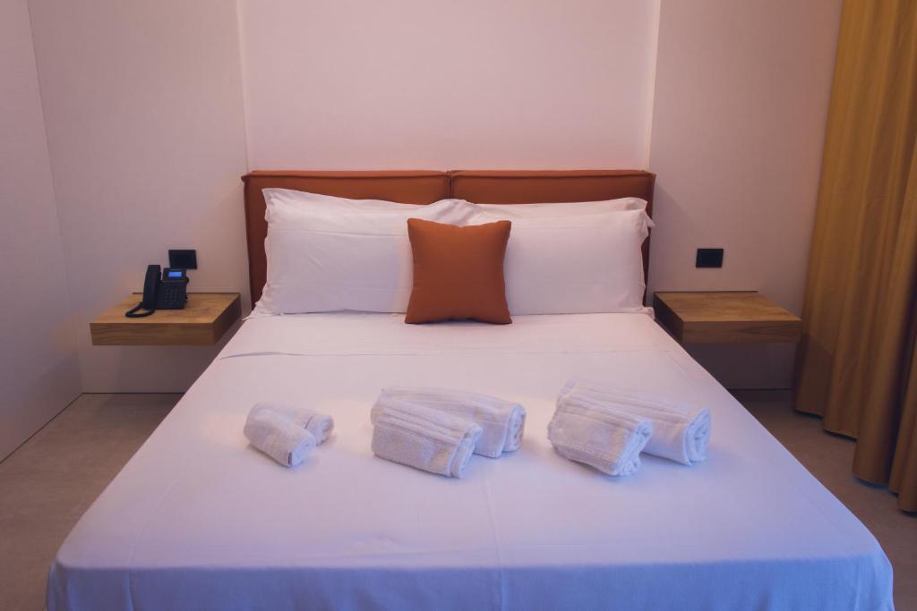 Postel nebo postele na pokoji v ubytování Sunset Hotel
