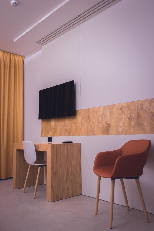 TV a/nebo společenská místnost v ubytování Sunset Hotel