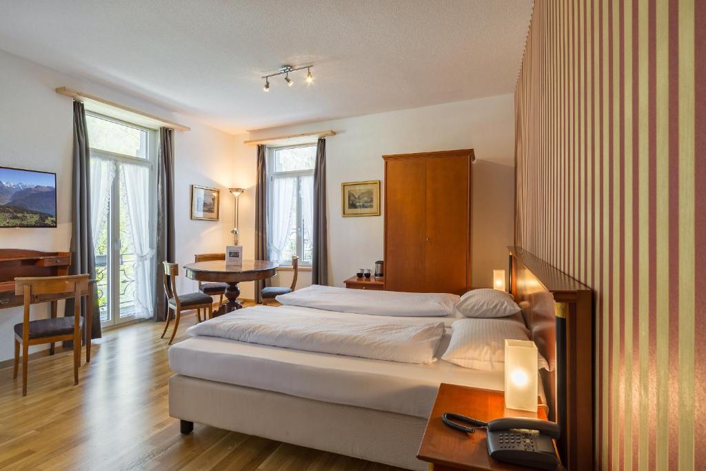 Postel nebo postele na pokoji v ubytování Carlton-Europe Vintage Adults Hotel