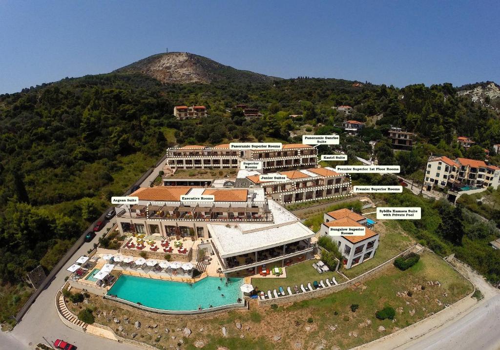 an aerial view of a resort with a mountain in the background at Kymi Palace in Kymi