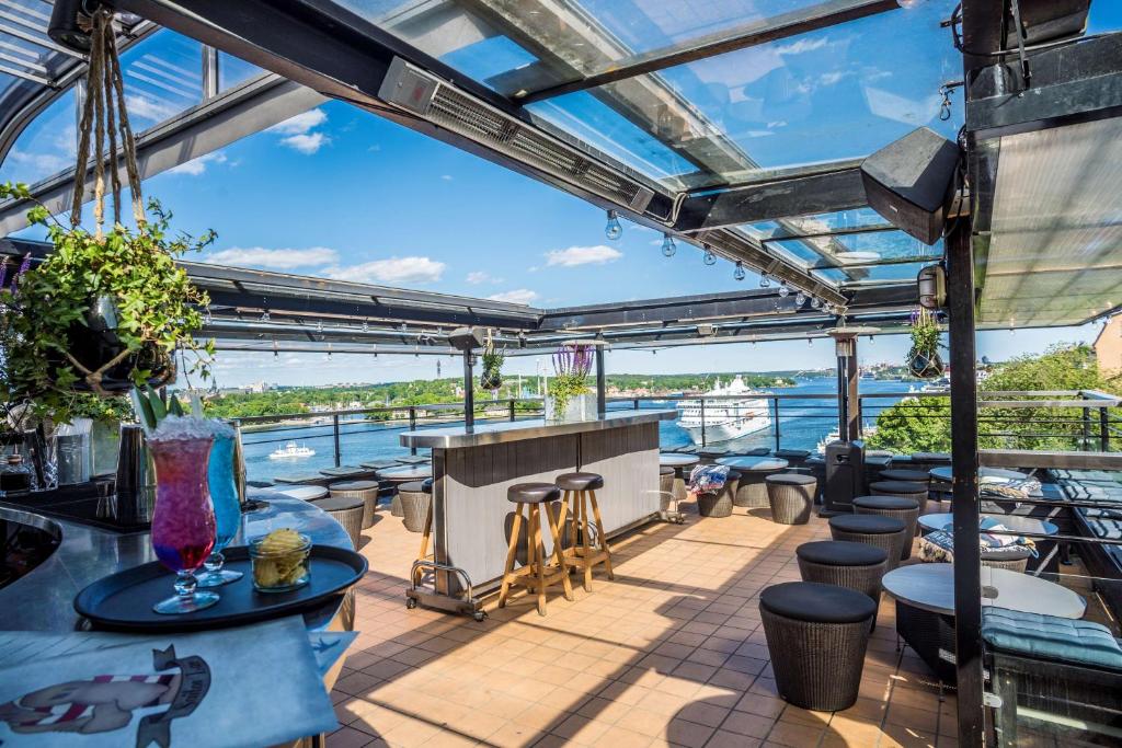a view from the deck of a boat with tables and chairs at Scandic Sjöfartshotellet in Stockholm