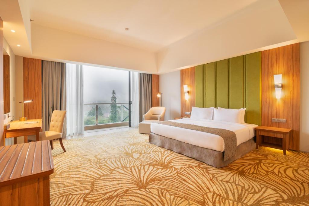 Postel nebo postele na pokoji v ubytování Zenith Hotel Cameron