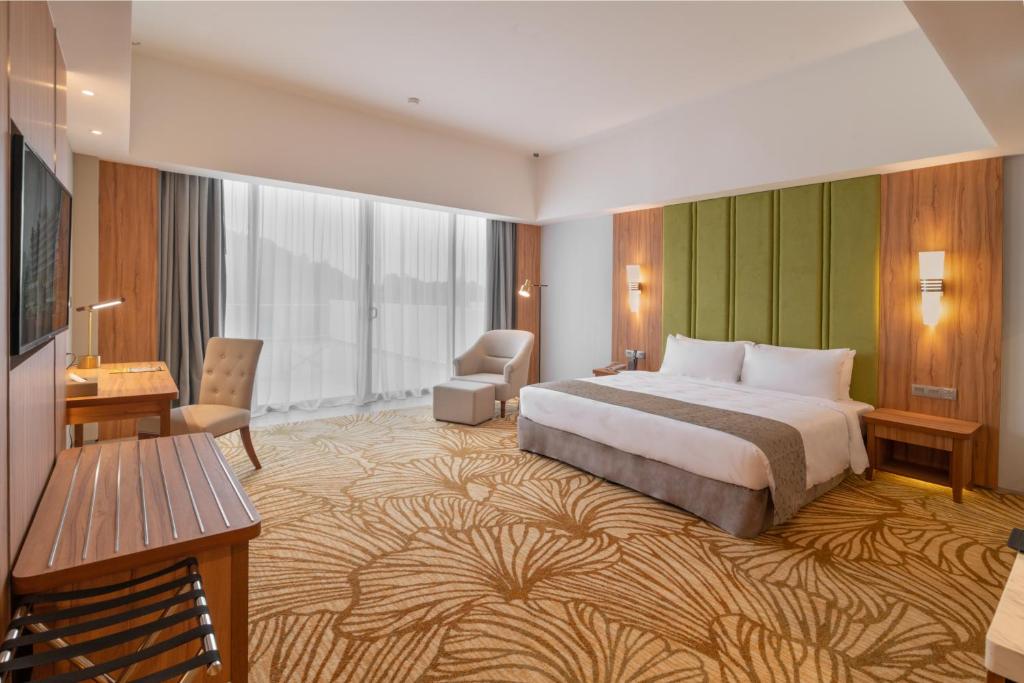 Postel nebo postele na pokoji v ubytování Zenith Hotel Cameron
