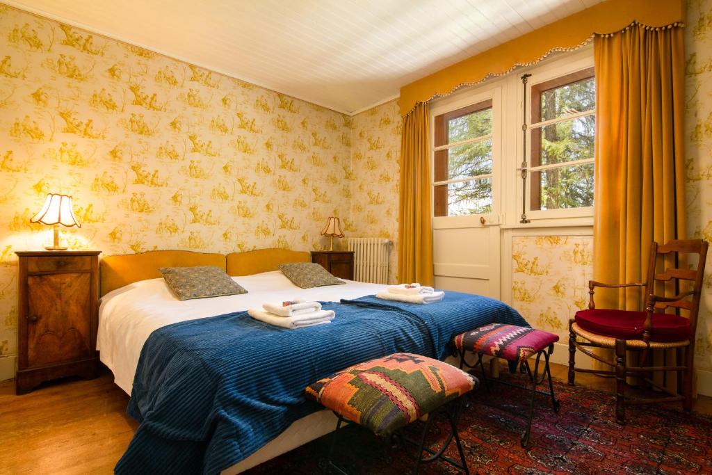 Un ou plusieurs lits dans un hébergement de l&#39;établissement Chalet Ecureuil - Happy Rentals