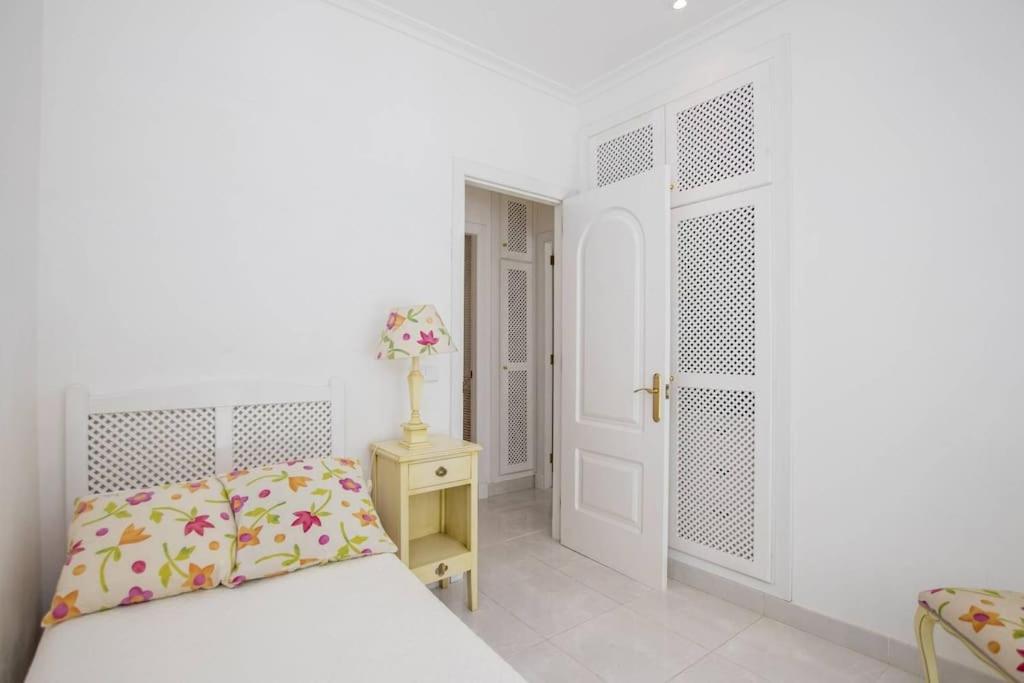 A bed or beds in a room at Menorca Villa Marbella