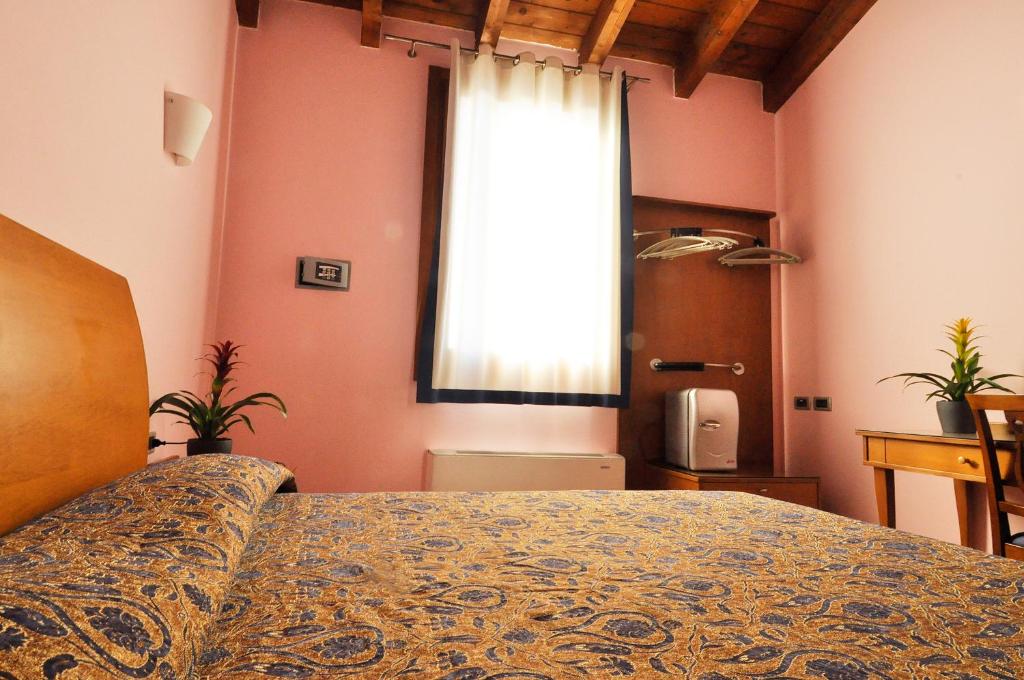 Posteľ alebo postele v izbe v ubytovaní Locanda Baraca