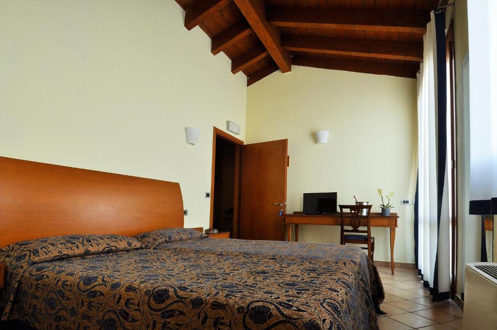 Posteľ alebo postele v izbe v ubytovaní Locanda Baraca