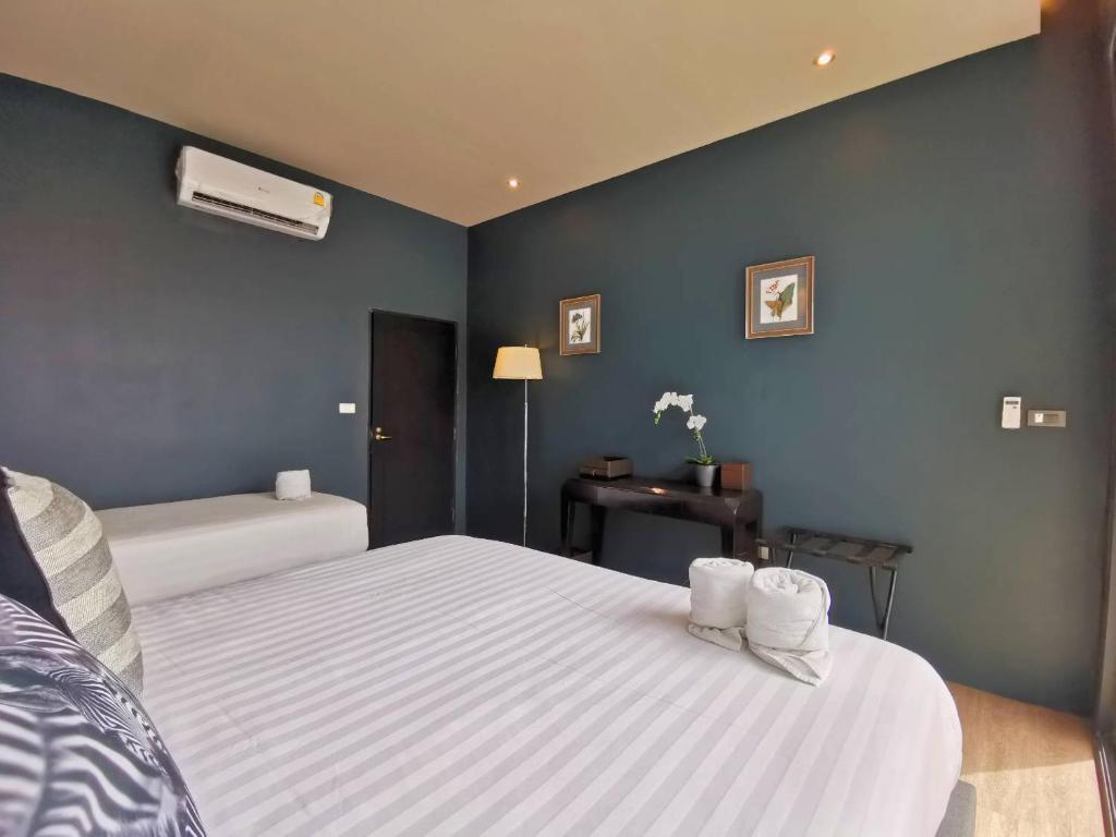 Postel nebo postele na pokoji v ubytování Dojo pool villa