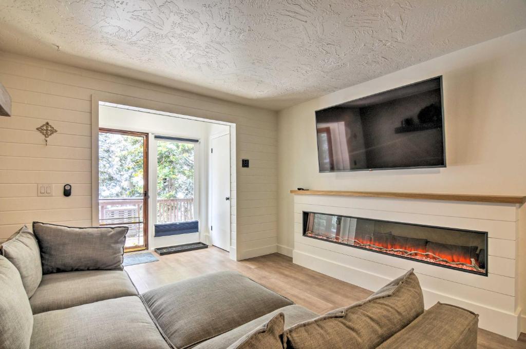 a living room with a couch and a fireplace at The Cottages Ski-InandOut Retreat - Hike and Explore! in Beaver