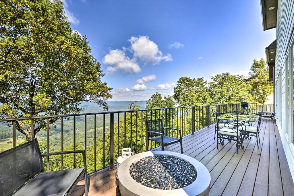 a deck with a tub and chairs on a balcony at Scenic Sanctuary in Lookout Mountain with Views! in Trenton