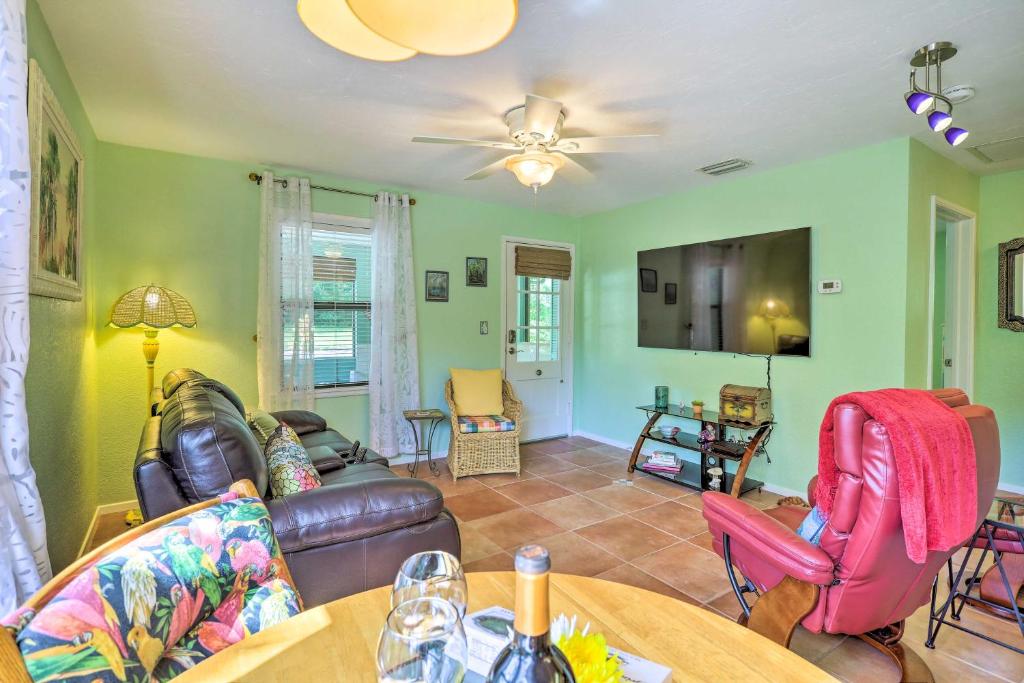 a living room with a couch and a table at Vibrant Rockledge Home about 2 Mi to Cocoa Village! in Rockledge