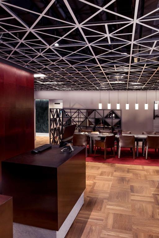 a conference room with a table and chairs at Radisson Collection, Strand Hotel, Stockholm in Stockholm
