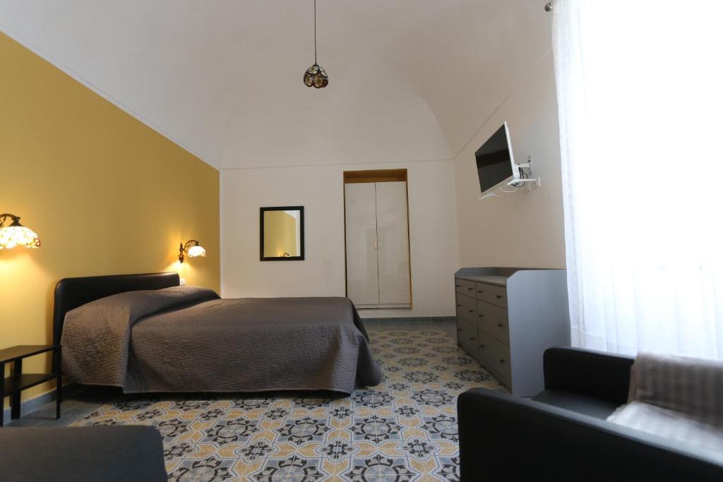 Postel nebo postele na pokoji v ubytování B&B ex Albergo Centrale ATESSA CENTRO