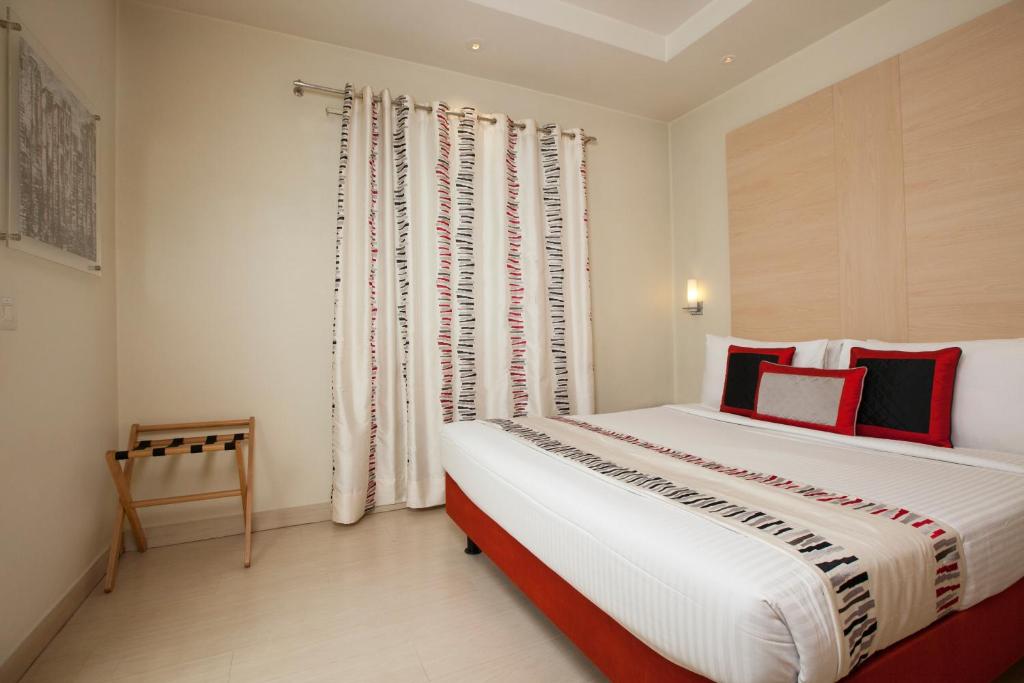 Postel nebo postele na pokoji v ubytování Avalon Courtyard Residence Suites